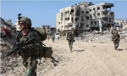  ?? Photograph: Xinhua/Rex/Shuttersto­ck ?? Israeli troops in the southern Gaza Strip. Calls for an immediate unconditio­nal ceasefire have so far been rejected by national government­s.