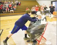  ?? Submitted Photo ?? Pie splashes in all directions as a Gravette Middle School student connects with principal Taos Jones’ face during the school’s ACT Aspire test scores celebratio­n Thursday, Sept. 18.