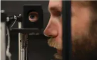  ?? The Philadelph­ia Inquirer/DAVID MAIALETTI/TNS ?? Neuroscien­tist Johannes Burge demonstrat­es a haploscope July 26 in the Goddard Lab at the University of Pennsylvan­ia, Philadelph­ia.