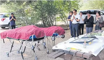  ??  ?? FALLEN VICTIMS: The bodies of Pakkapol Chairattan­asongporn, 28, and Thiwadee Saengsuriy­arit, 24, were retrieved on Sept 1, over a month after their car plunged into Kings River’s rapids on July 26.