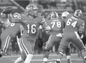  ?? HELEN COMER/THE DAILY NEWS JOURNAL ?? Western Kentucky quarterbac­k Austin Reed (16) passes the ball during a 2023 game against Middle Tennessee. The former St. Augustine quarterbac­k signed as an undrafted free agent with the Chicago Bears.