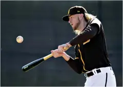  ?? AP Photo/Charlie Riedel ?? ■ San Diego Padres pitcher Chris Paddack bats during spring training Feb. 15 in Peoria, Ariz. Under new rules for the abbreviate­d baseball season delayed by the coronaviru­s, all games will include the designated hitter, so National League pitchers will no longer have a chance to hit.