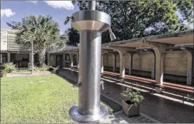  ?? PHOTOS BY RODOLFO GONZALEZ / AMERICAN-STATESMAN ?? Austin’s Parks Department and the newly formed Barton Springs Conservanc­y announced Monday they were partnering to renovate the bathhouse on the Barton Springs Pool grounds.