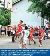  ??  ?? Nuwan Maduranga, who scored 18 points in the under15 final against St. Benedict’s scores another basket. He was named Most Valuable Player.