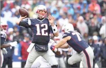  ?? BRETT CARLSEN/GETTY IMAGES/AFP ?? Tom Brady of the New England Patriots lines up a pass against the Buffalo Bills during the first half at New Era Field on Sunday in Buffalo, New York.