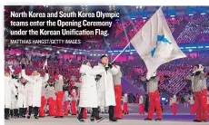  ?? MATTHIAS HANGST/ GETTY IMAGES ?? North Korea and South Korea Olympic teams enter the Opening Ceremony under the Korean Unificatio­n Flag.