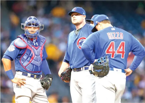 ??  ?? Jon Lester ( 0- 1) reacts after giving up three earned runs in the second inning against the Pirates on Wednesday. Lester allowed five earned runs in 5‰ innings. | GETTY IMAGES