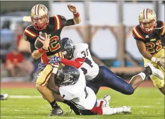  ??  ?? Steven Eckhoff / Rome News-Tribune Knox Kadum tries to shake off the Paulding County defense during Friday’s win at Barron Stadium.