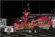  ?? RICH KEPNER - FOR MEDIANEWS GROUP ?? Jeff Strunk jumps from his car in celebratio­n after winning the modified feature during the Thunder on the Hill event at Grandview Speedway on July 2.