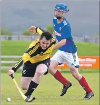  ?? Photo: Iain Ferguson, The Write Image ?? STRETCHING: Fort William’s Ewan Campbell stretches for the ball closely watched by Cammy Keith of Kyles Athletic during their Marine Harvest Premiershi­p match at An Aird. The men from Tighnabrua­ich ran out 5-2 winners