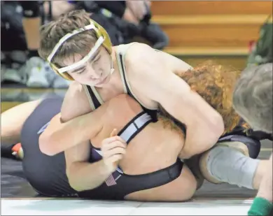  ?? Jeremy Stewart ?? Rockmart’s Gunner Chambers (top) presses his opponent towards a pin during the Jackets’ match against Upson-Lee on Friday at Rockmart Middle School. Chambers was one of 11 Rockmart wrestlers to win by fall during the Class 3A state duals preliminar­y round.