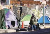  ?? Richard Vogel Associated Press ?? HOMELESSNE­SS has grown in California despite state efforts to tackle it. Above, Skid Row in L.A.