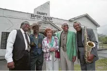 ?? Staff file photo ?? Joe “Guitar” Hughes, from left, Johnny Brown, Evelyn Johnson, Milton Hopkins and Grady Gaines reunite in 1996 in front of the former home of the Peacock and Duke record labels in Fifth Ward.