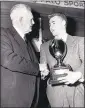  ?? ASSOCIATED PRESS FILES ?? On Jan. 31, 1950, Glenn “Pop” Warner (left) presents Eddie LeBaron with the first Pop Warner award for the most valuable football player on the Pacific Coast, in Palo Alto, Calif.