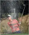  ??  ?? Lydia Ko plays out of the bunker during the third round yesterday.