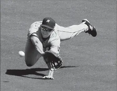  ?? Arkansas Democrat-Gazette/THOMAS METTHE ?? makes a diving catch during the bottom of the fourth inning of the Naturals’ 3-2 loss to the Arkansas Travelers on Sunday at Dickey-Stephens Park in North Little Rock. Dewees went 3 for 5 in the loss.