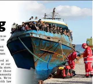  ?? COSTAS METAXAKIS/AGENCE FRANCE-PRESSE ?? HELLENIC Red Cross rescuers and health workers stand by a boat carrying some 400 refugees and migrants at the town of Paleochora, southweste­rn Crete island, Greece following a rescue operation.