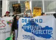  ?? AP FILE PHOTO BY JEFF CHIU ?? In this 2018 photo, supporters of temporary protected status of immigrants cheer as they hold signs and banners with the outline of El Salvador at a rally at a federal courthouse in San Francisco.