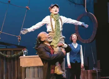  ?? MATTHEW OMILIANOWS­KI ?? Beatty Barnes, left, as Ebenezer Scrooge, Adalee Alt as Tiny Tim and actor Sarah Manton as Belle. The Wells Theatre production ends on Dec. 31.