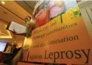  ?? Narong Sangnak/EPA ?? Attendees walk past a banner at the Internatio­nal Leprosy Summit at a meeting room in Bangkok in 2013. Photograph: