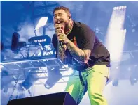  ?? AMY HARRIS/ INVISION/ ASSOCIATED PRESS ?? Singer/ songwriter Post Malone, shown performing in Chicago in July, is one of the many celebritie­s who will be attending Formula One festivitie­s this weekend in Miami.