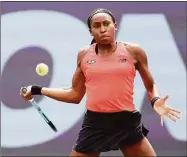  ?? Matthew Stockman / Getty Images ?? Coco Gauff returns a shot to Victoria Azarenka during the Guadalajar­a Open on Friday in Zapopan, Mexico.