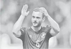  ?? — AFP photo ?? Scotland’s midfielder Shaun Maloney applauds supporters after the Euro 2016 Qualifier, Group D football match between Scotland and Republic of Ireland at Celtic Park in Glasgow, Scotland on November 14, 2014.