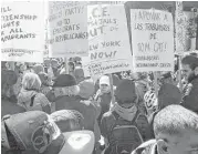  ?? Julie Walker / Associated Press ?? Tom Cat Bakery employees and their supporters rally against President Donald Trump’s immigratio­n policies Saturday outside Trump Tower in New York.