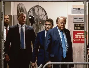  ?? Dave Sanders/Associated Press ?? Former President Donald Trump returns to the courtroom after a break during his ongoing trial at Manhattan criminal court before his trial in New York on Friday.