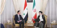  ?? (Official Presidenti­al website/Handout via Reuters) ?? IRAN’S PRESIDENT Ebrahim Raisi meets with Syrian President Bashar Assad in Tehran yesterday.