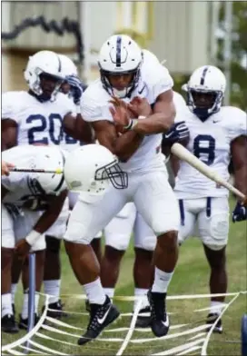  ?? PHOEBE SHEEHAN — CENTRE DAILY TIMES VIA AP ?? Penn State running back Saquon Barkley Saturday in State College. runs a drill during media day