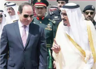  ?? AFP ?? RIYADH: Saudi Arabia’s King Salman bin Abdulaziz (right) receives Egyptian President Abdel Fattah Al-Sisi upon the latter’s arrival yesterday.—