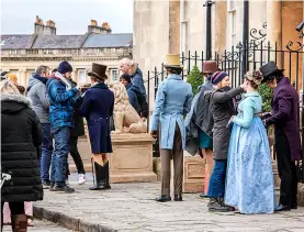  ?? ?? Left, actors pictured during filming for the first series of Bridgerton in 2019. Film crews were spotted at locations across Bath. Right, crews filming ‘covertly’ at the Holburne Museum last year.