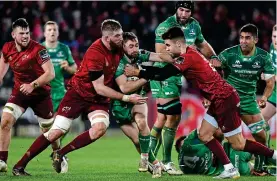  ??  ?? CRUSHED: Connacht’s Caolin Blade is tackled by Conor Murray and Darren O’Shea