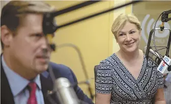  ?? STAFF PHOTO BY MARK GARFINKEL ?? TOEING THE TRUMP LINE: From left, Geoff Diehl and Beth Lindstrom talk yesterday during a primary election debate in the studios of Boston Herald Radio.