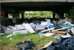  ??  ?? BLIGHT: Discarded items under an A40 bridge in Buckingham­shire