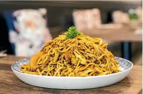  ?? ?? Malay Mee Goreng noodle dish, served with chicken, prawns or tofu.