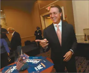  ??  ?? This July 22, 2014, file photo shows Republican candidate for U.S. Senate David Perdue as he greets supporters in Atlanta, at his electionni­ght watch party. Minutes after Perdue won his Republican Senate primary in Georgia, a grainy image of his...