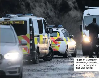  ??  ?? Police at Butterley Reservoir, Marsden, after the body of a man was found