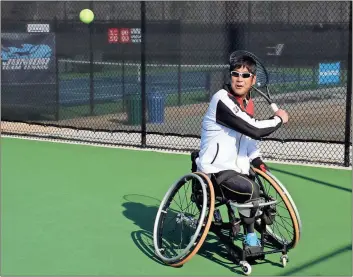  ?? Doug Walker / RN-T ?? Satoshi Saida of Japan prepares a backhand return during warm-up for the Georgia Open ITF wheelchair tennis tournament at the Rome Tennis Center. Play will begin today in the profession­al tour event and will continue through the weekend. Read more...