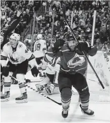  ?? Andy Cross, The Denver Post ?? Avalanche center Colin Wilson celebrates his power-play goal against the San Jose Sharks during the third period Thursday night at the Pepsi Center.