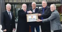  ?? WAYNE EMDE/Special to The Daily Courier ?? RCMP Appreciati­on Day petitioner­s Martin von Holst, middle, and Guy Bailey, second from right, present a box of petitions to Vernon-Monashee MLA Eric Foster, second from left, Thursday at Vernon City Hall. With them are North Okanagan-Shuswap MP Mel Arnold, left, and Vernon Mayor Victor Cumming.