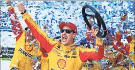  ?? / AP-Steve Helber ?? Joey Logano celebrates after winning the Monster Energy NASCAR Cup Series at Martinsvil­le Speedway in Martinsvil­le, Va., on Sunday.