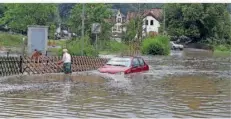  ?? FOTO: THOMAS SEEBER ?? Ein Bild vom Juli 2009 aus dem Quierschie­der Ortsteil Fischbach, wo damals die Quierschie­der Straße unter Wasser stand.