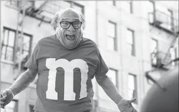  ?? Associated Press ?? CELEBRITIE­S PROVIDED the bulk of the comedy in ads aired during the Super Bowl. Among them, Danny DeVito, above, plays a human M&M who avoids getting eaten but gets slammed by a bus.