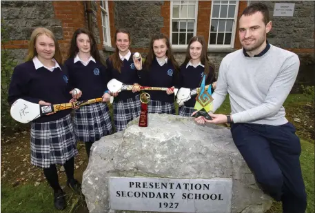  ?? Photo by John Reidy ?? Celebratin­g their great Croke Park achievemen­ts back at school on Friday morning were teacher Pierce Dargan with, from left, Tara Enright, Joanna Moynihan, Fiona Brosnan, Chantelle Broderick and Katie Cotter.