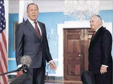  ?? Carolyn Kaster Associated Press ?? RUSSIAN Foreign Minister Sergei Lavrov, left, meets with Secretary of State Rex Tillerson. The White House disclosed the president’s talks with Lavrov but not Russian Ambassador Sergey Kislyak’s attendance.