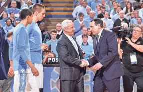  ??  ?? North Carolina head coach Roy Williams, left, with Duke head coach Mike Krzyzewski have a rivalry on the basketball court as well as on the recruiting trail.