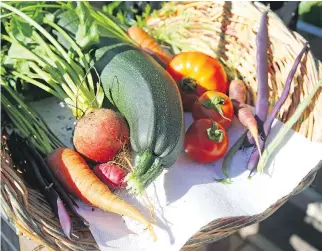  ??  ?? They started out with just a few herbs, but Conrad Melanson and Anne-Marie Gervais now grow an array of fruits and vegetables.