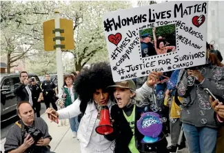  ?? PHOTOS: AP ?? Protesters demonstrat­e after Bill Cosby departed his sexual assault trial at the Montgomery County Courthouse in Norristown, Pennsylvan­ia yesterday.